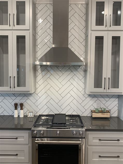 herringbone tile backsplash layout.